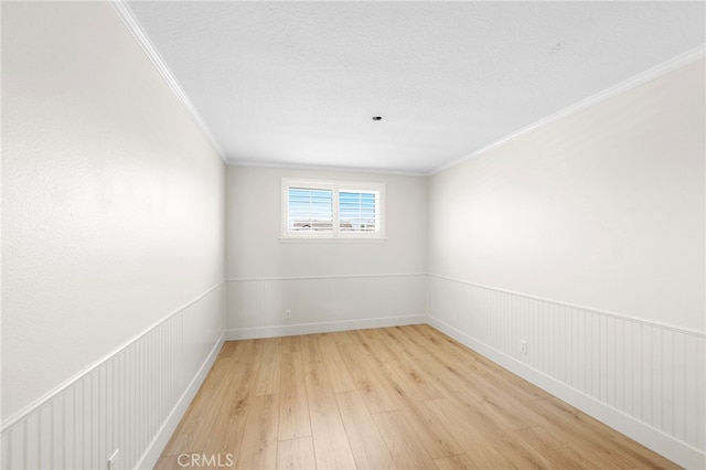 25311 Misty Rdg, Mission Viejo, CA 92692 - spare room featuring light wood-style floors and crown molding