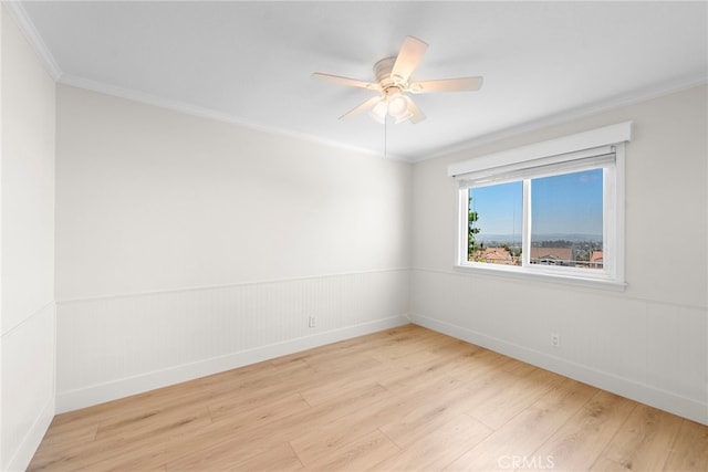 25311 Misty Rdg, Mission Viejo, CA 92692 - unfurnished room featuring wood finished floors, crown molding, baseboards, a ceiling fan, and a wainscoted wall