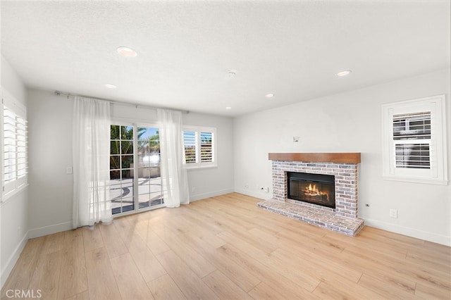 25311 Misty Rdg, Mission Viejo, CA 92692 - unfurnished living room with wood finished floors, a fireplace, baseboards, and recessed lighting