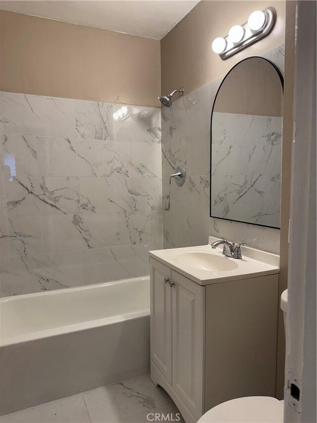 7531 Del Rosa Ave, San Bernardino, CA 92410 - full bath with toilet, vanity, bathing tub / shower combination, and marble look tiles