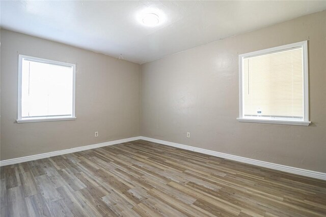 7531 Del Rosa Ave, San Bernardino, CA 92410 - unfurnished room featuring wood finished floors and baseboards