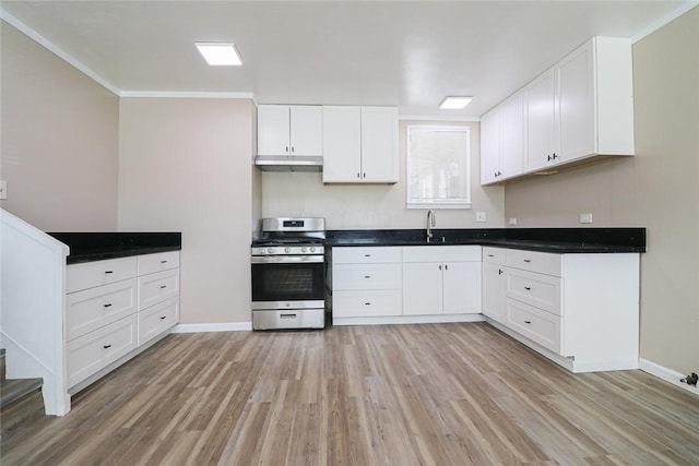 7531 Del Rosa Ave, San Bernardino, CA 92410 - kitchen featuring gas range, a sink, under cabinet range hood, light wood finished floors, and white cabinets