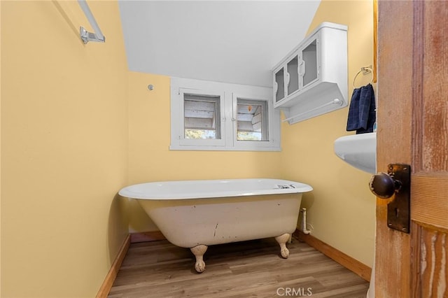 233 Glen Avon Dr, Cedar Glen, CA 92321 - bathroom featuring a freestanding bath, wood finished floors, and baseboards