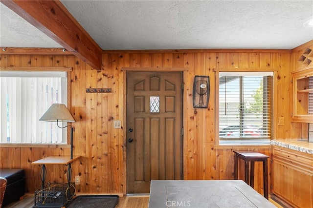 233 Glen Avon Dr, Cedar Glen, CA 92321 - entryway with a textured ceiling, wood finished floors, and wooden walls