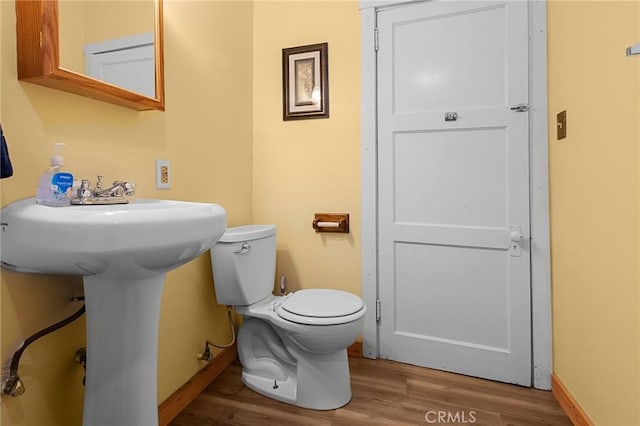 233 Glen Avon Dr, Cedar Glen, CA 92321 - half bathroom featuring wood finished floors, toilet, baseboards, and a sink