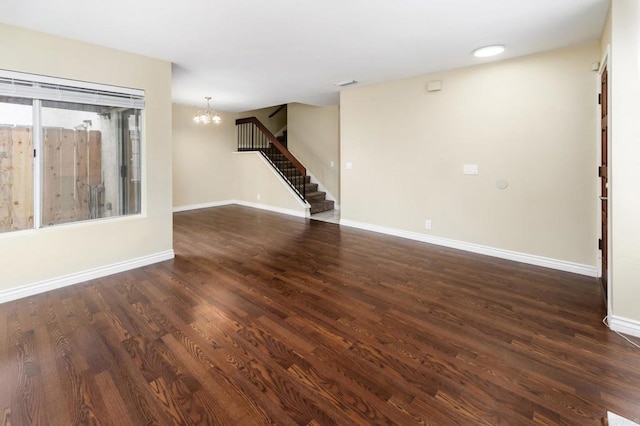 1253 Manzana Way, San Diego, CA 92139 - unfurnished living room featuring a chandelier, stairway, dark wood-type flooring, and baseboards