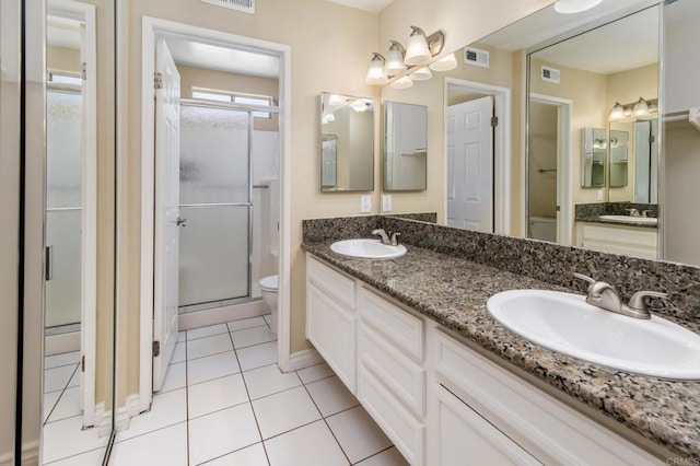 1253 Manzana Way, San Diego, CA 92139 - full bathroom featuring toilet, double vanity, a stall shower, tile patterned flooring, and a chandelier