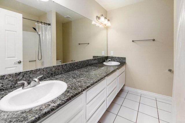 1253 Manzana Way, San Diego, CA 92139 - full bathroom with double vanity, tile patterned flooring, toilet, baseboards, and a shower with curtain