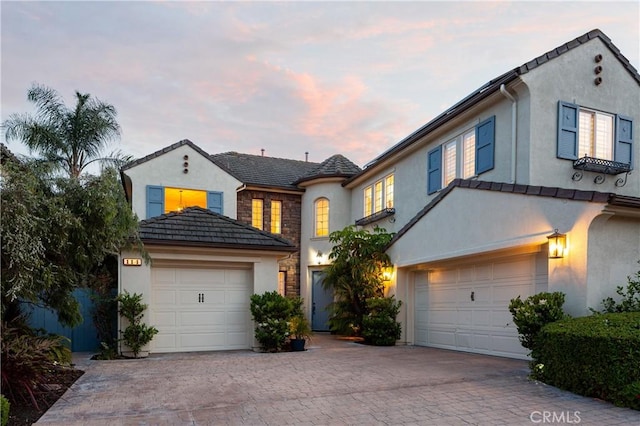 114 Via Monte Picayo, San Clemente, CA 92673 - view of front facade featuring stucco siding, driveway, stone siding, and a tiled roof