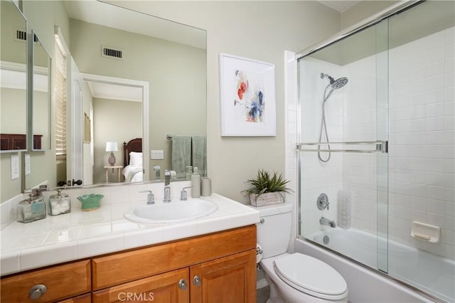 114 Via Monte Picayo, San Clemente, CA 92673 - ensuite bathroom featuring vanity, shower / bath combination with glass door, and toilet