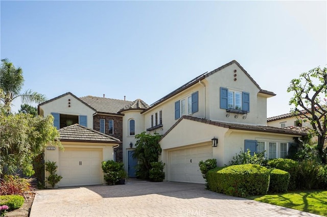 114 Via Monte Picayo, San Clemente, CA 92673 - view of front facade with stucco siding, a tiled roof, and decorative driveway