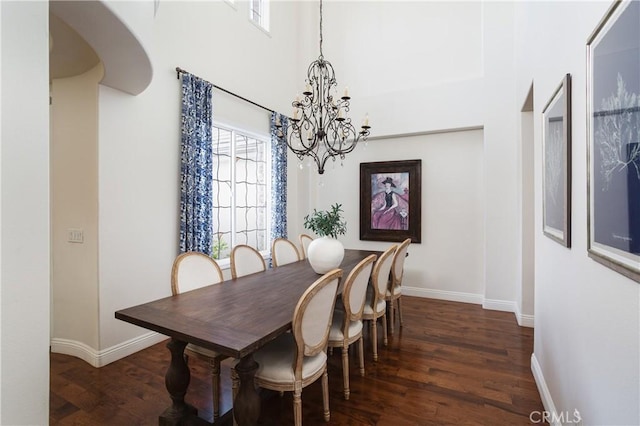 114 Via Monte Picayo, San Clemente, CA 92673 - dining area featuring a chandelier, wood finished floors, baseboards, and a towering ceiling