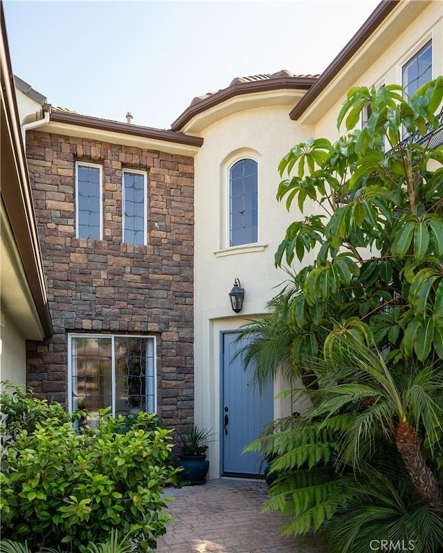 114 Via Monte Picayo, San Clemente, CA 92673 - view of exterior entry featuring stone siding and stucco siding