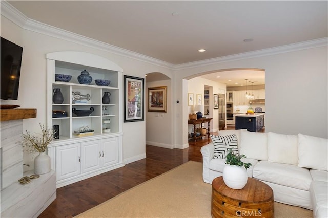 114 Via Monte Picayo, San Clemente, CA 92673 - living area featuring crown molding, arched walkways, dark wood-style floors, and recessed lighting