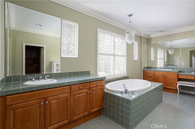 114 Via Monte Picayo, San Clemente, CA 92673 - full bathroom featuring two vanities, a garden tub, ornamental molding, and tile patterned flooring