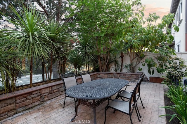 114 Via Monte Picayo, San Clemente, CA 92673 - patio terrace at dusk with a patio area, outdoor dining area, and a fenced backyard