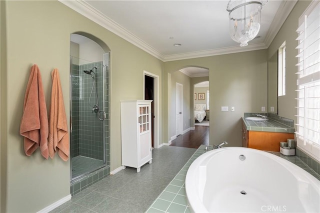 114 Via Monte Picayo, San Clemente, CA 92673 - ensuite bathroom with a shower stall, crown molding, a bath, vanity, and baseboards