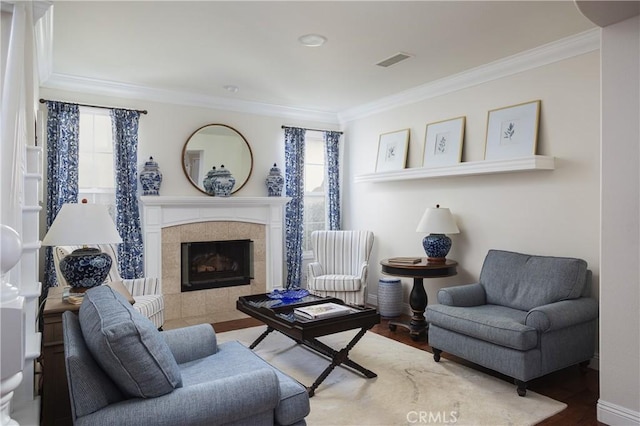 114 Via Monte Picayo, San Clemente, CA 92673 - living area featuring crown molding, plenty of natural light, wood finished floors, a tile fireplace, and baseboards