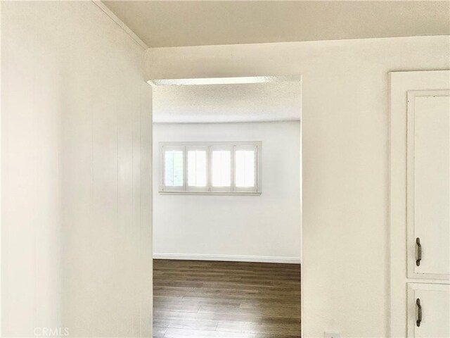 897 Ronda Sevilla C, Laguna Woods, CA 92637 - empty room with wood finished floors and baseboards