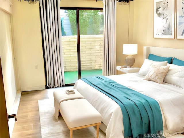 897 Ronda Sevilla C, Laguna Woods, CA 92637 - bedroom featuring access to outside and wood finished floors