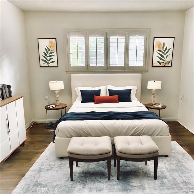 897 Ronda Sevilla C, Laguna Woods, CA 92637 - bedroom with wood finished floors and baseboards