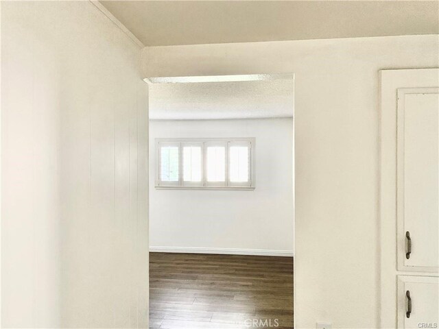 897 Ronda Sevilla C, Laguna Woods, CA 92637 - empty room with wood finished floors and baseboards