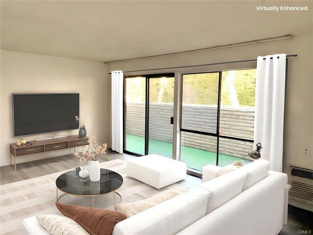 897 Ronda Sevilla C, Laguna Woods, CA 92637 - living room with healthy amount of natural light and wood finished floors