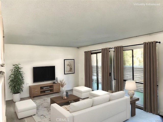 897 Ronda Sevilla C, Laguna Woods, CA 92637 - living area featuring light wood-style floors