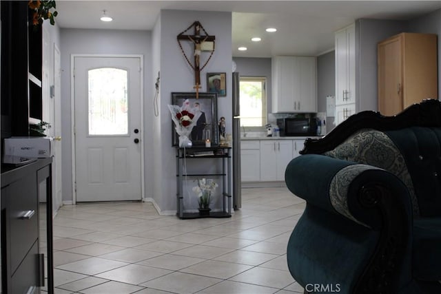 3360 Winstrom St, Riverside, CA 92504 - foyer entrance featuring light tile patterned floors and recessed lighting