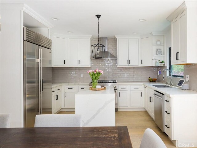 618 W Elm Ave, El Segundo, CA 90245 - kitchen with high quality appliances, wall chimney exhaust hood, open shelves, a sink, and a center island