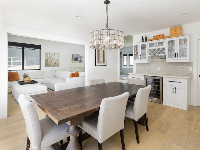 618 W Elm Ave, El Segundo, CA 90245 - dining area with wine cooler, light wood-type flooring, a dry bar, and recessed lighting