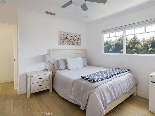 618 W Elm Ave, El Segundo, CA 90245 - bedroom with ornamental molding, light wood-style floors, baseboards, and a ceiling fan