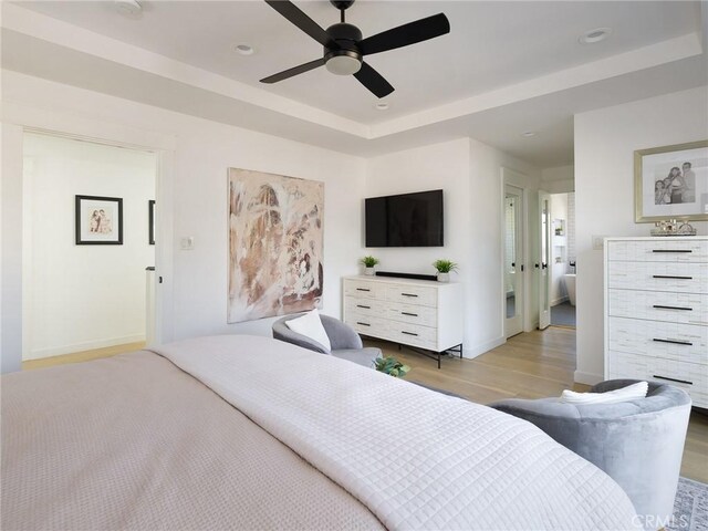 618 W Elm Ave, El Segundo, CA 90245 - bedroom with light wood-style flooring, a raised ceiling, baseboards, a ceiling fan, and recessed lighting