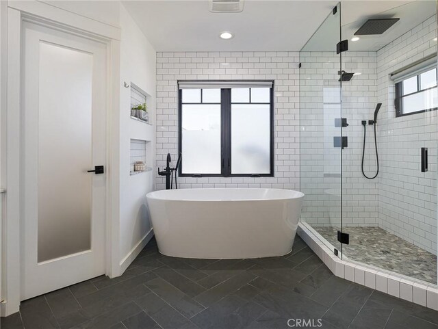 618 W Elm Ave, El Segundo, CA 90245 - bathroom with a stall shower, a soaking tub, recessed lighting, and tile walls