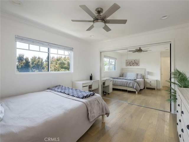 618 W Elm Ave, El Segundo, CA 90245 - bedroom featuring ornamental molding, light wood-style flooring, a closet, and ceiling fan