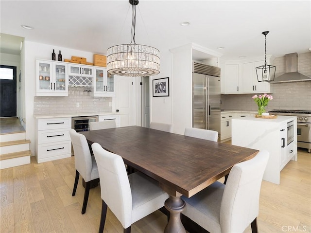 618 W Elm Ave, El Segundo, CA 90245 - dining area featuring light wood-style flooring, recessed lighting, wine cooler, and a chandelier
