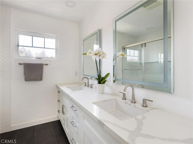 618 W Elm Ave, El Segundo, CA 90245 - bathroom featuring plenty of natural light, double vanity, a tile shower, and tile patterned flooring