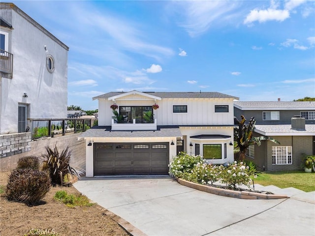 618 W Elm Ave, El Segundo, CA 90245 - view of front of property featuring driveway, a garage, and board and batten siding