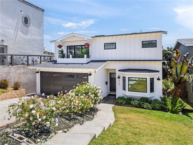 618 W Elm Ave, El Segundo, CA 90245 - view of front facade with a front yard, an attached garage, and a shingled roof