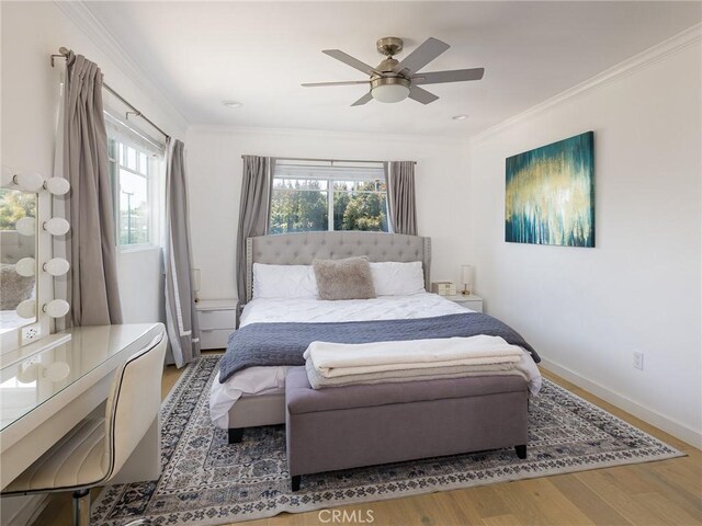 618 W Elm Ave, El Segundo, CA 90245 - bedroom featuring multiple windows, wood finished floors, ornamental molding, a ceiling fan, and baseboards