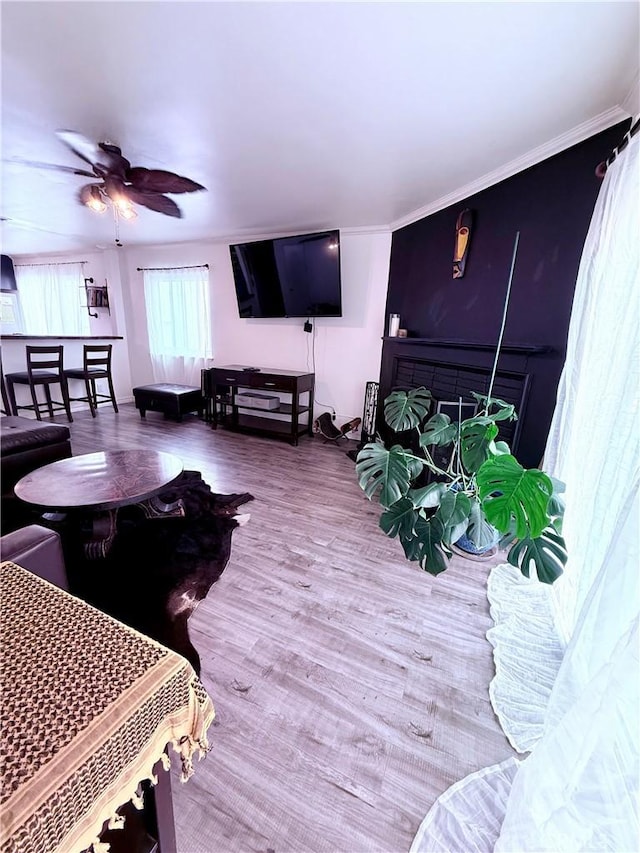19303 Kemp Ave, Carson, CA 90746 - living area with ceiling fan, wood finished floors, and crown molding