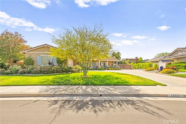 42302 Oregon Trl, Murrieta, CA 92562 - view of front of house with a front lawn and curved driveway