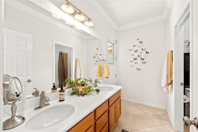 42302 Oregon Trl, Murrieta, CA 92562 - full bath featuring double vanity, crown molding, toilet, tile patterned floors, and baseboards