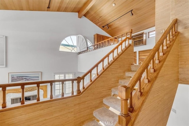 1110 Esplanade Unit 6, Redondo Beach, CA 90277 - stairway with high vaulted ceiling, wood finished floors, and wooden ceiling with exposed beams