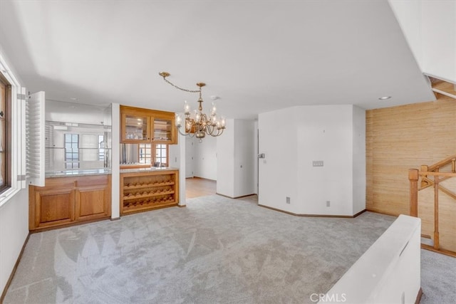 1110 Esplanade Unit 6, Redondo Beach, CA 90277 - unfurnished dining area featuring light carpet, a chandelier, and baseboards