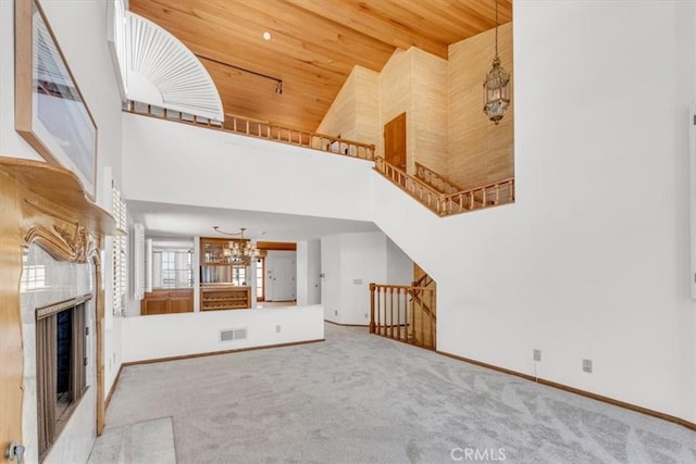 1110 Esplanade Unit 6, Redondo Beach, CA 90277 - unfurnished living room featuring high vaulted ceiling, a chandelier, wooden ceiling, carpet, and baseboards