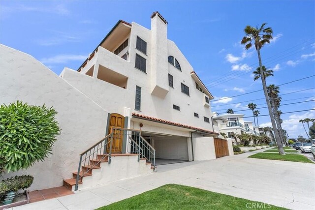 1110 Esplanade Unit 6, Redondo Beach, CA 90277 - view of property with an attached garage and concrete driveway
