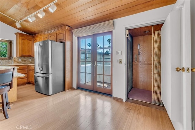 1110 Esplanade Unit 6, Redondo Beach, CA 90277 - kitchen featuring freestanding refrigerator, track lighting, light wood-style flooring, brown cabinets, and wood ceiling