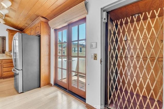 1110 Esplanade Unit 6, Redondo Beach, CA 90277 - entryway with french doors, wooden ceiling, and light wood finished floors