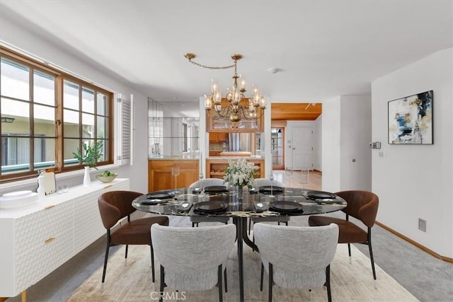 1110 Esplanade Unit 6, Redondo Beach, CA 90277 - dining room with a chandelier, baseboards, and light colored carpet